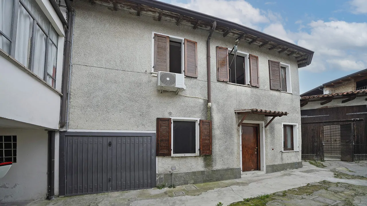 Exterior facade of house with windows and entrance door
