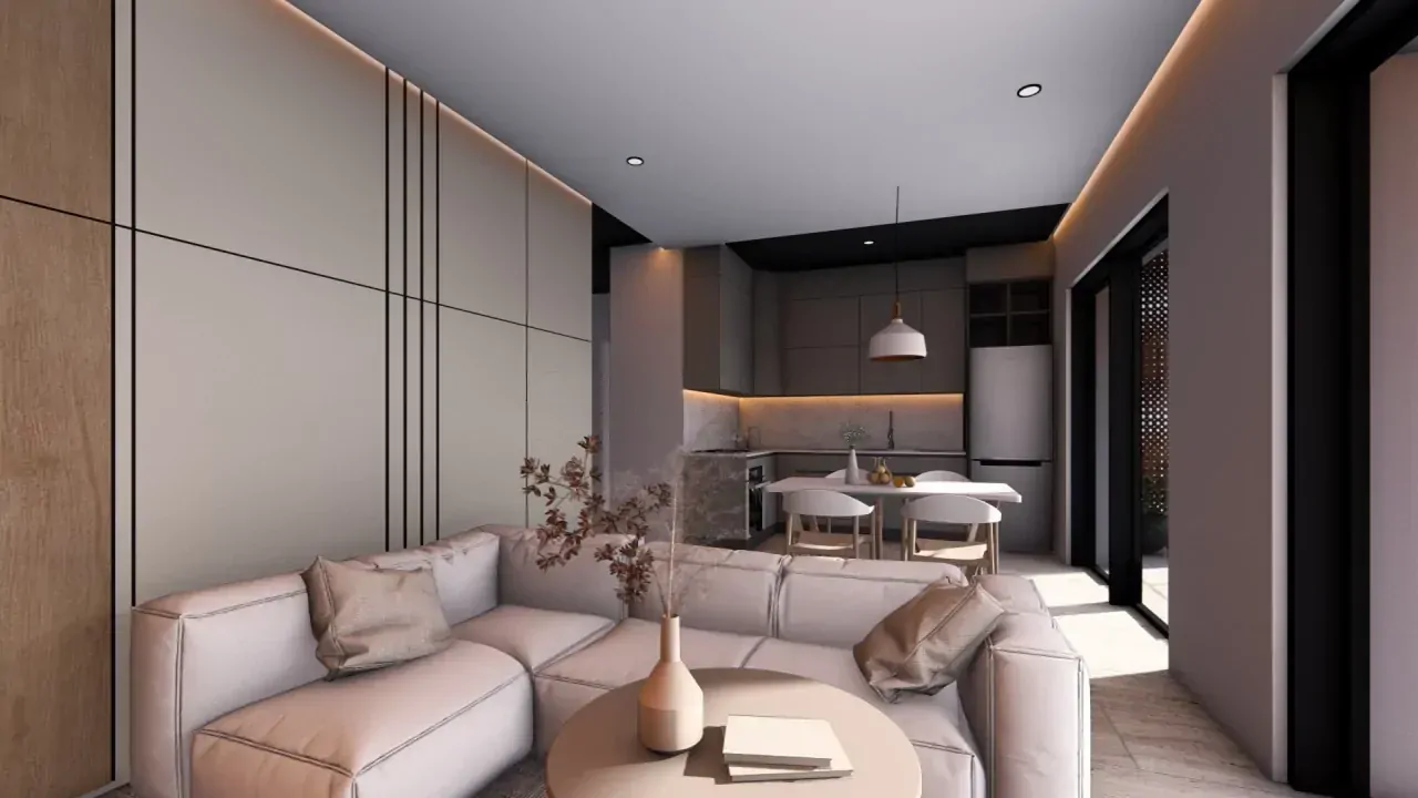 Wohnzimmer mit Ecksofa und offener Küche