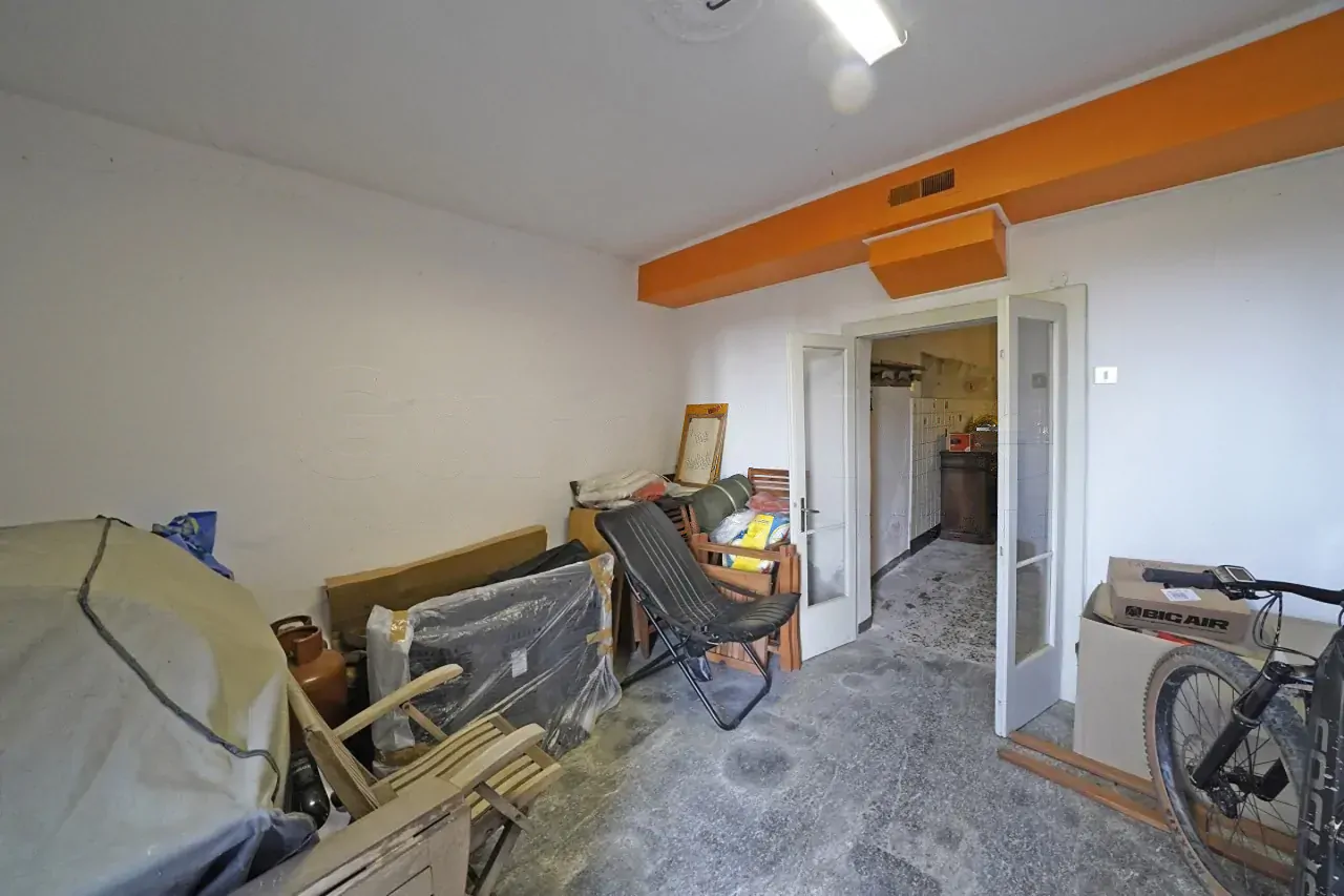 Storage room with stacked furniture and boxes