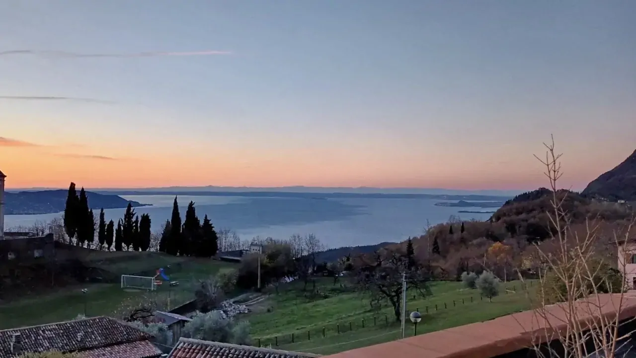 Panoramic view of lake and hills at sunset
