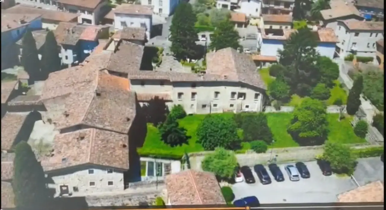 Aerial view of the ancient residence with garden and parking in Padenghe sul Garda