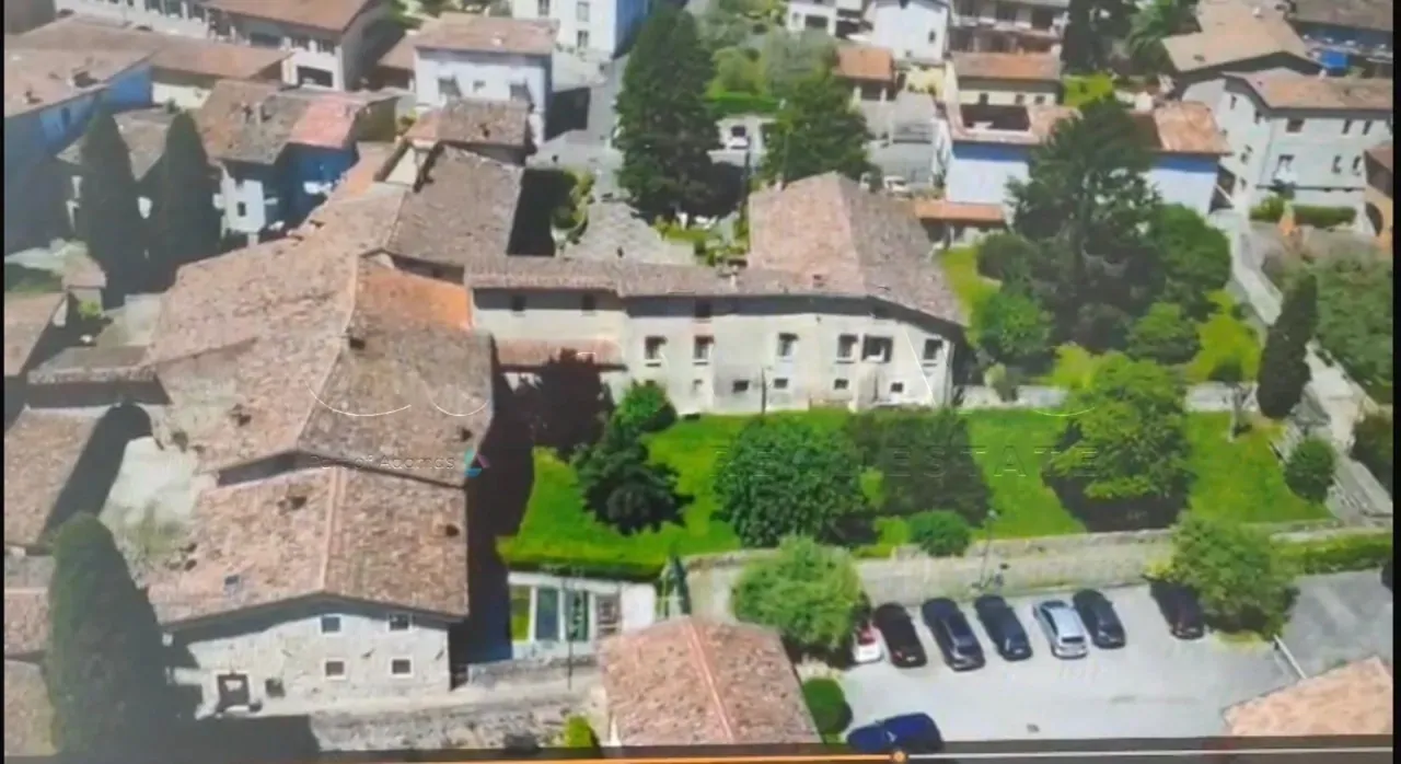 Aerial view of the ancient residence with garden and parking in Padenghe sul Garda