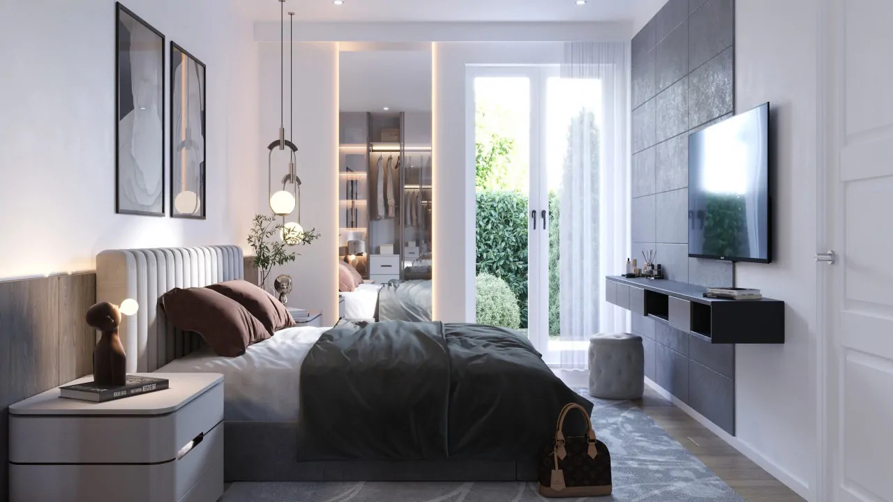 Schlafzimmer mit Doppelbett und Glastür zum Garten