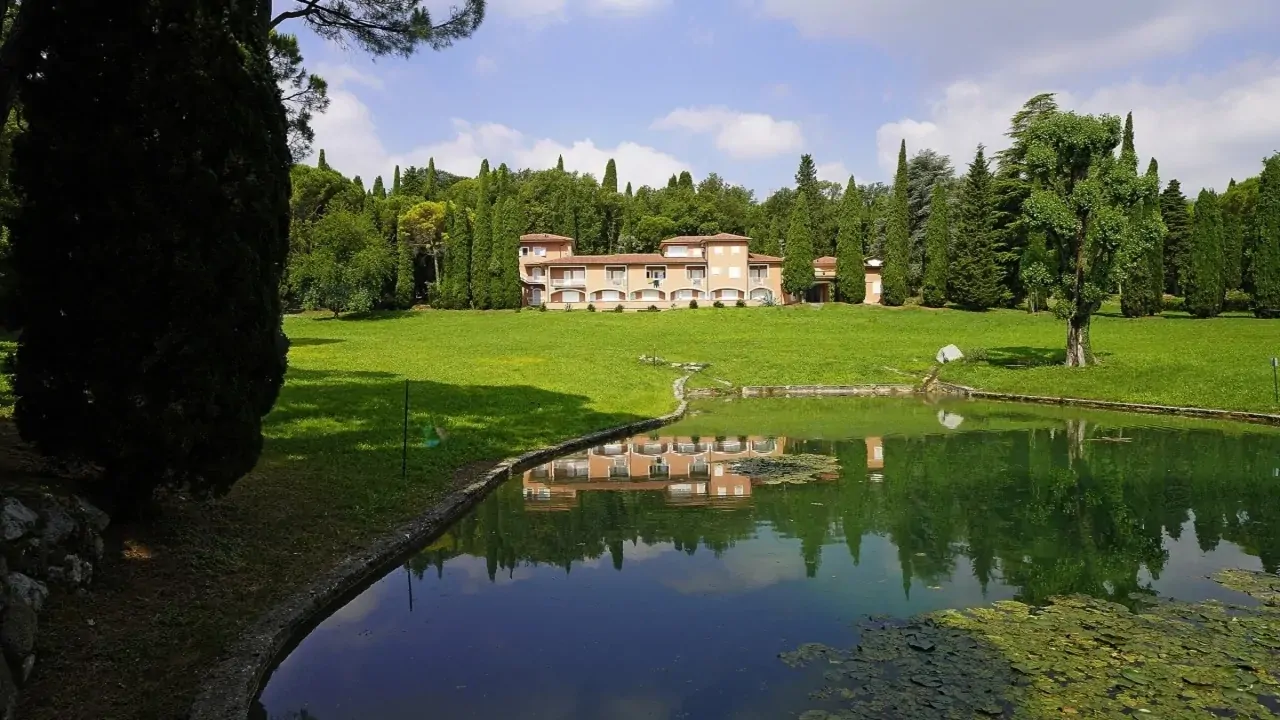 Residential building with park and reflecting pond