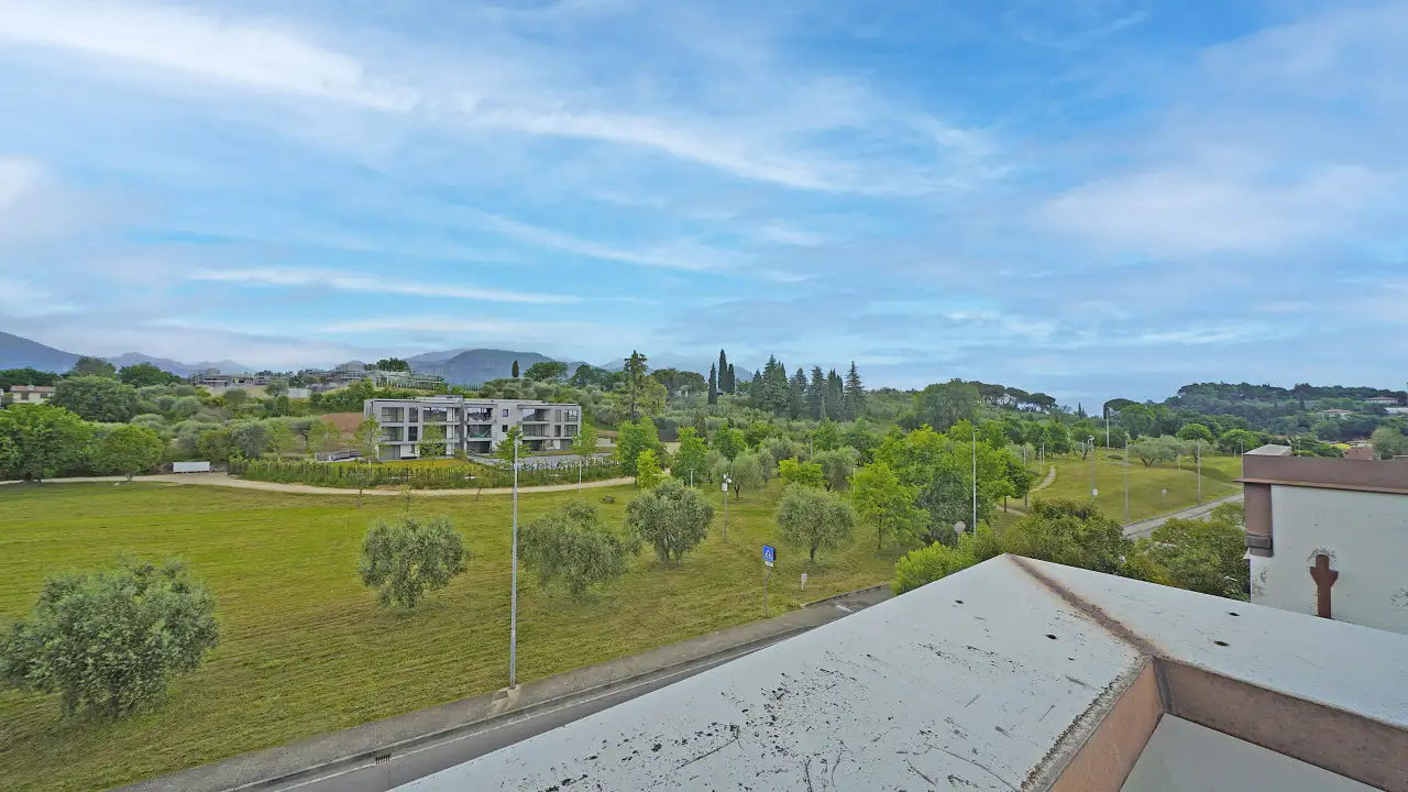 Panoramic view of green area and road from terrace