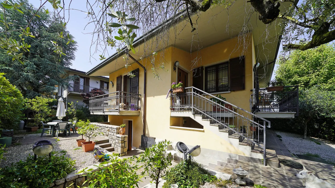 Exterior of the villa with garden and entrance stairs