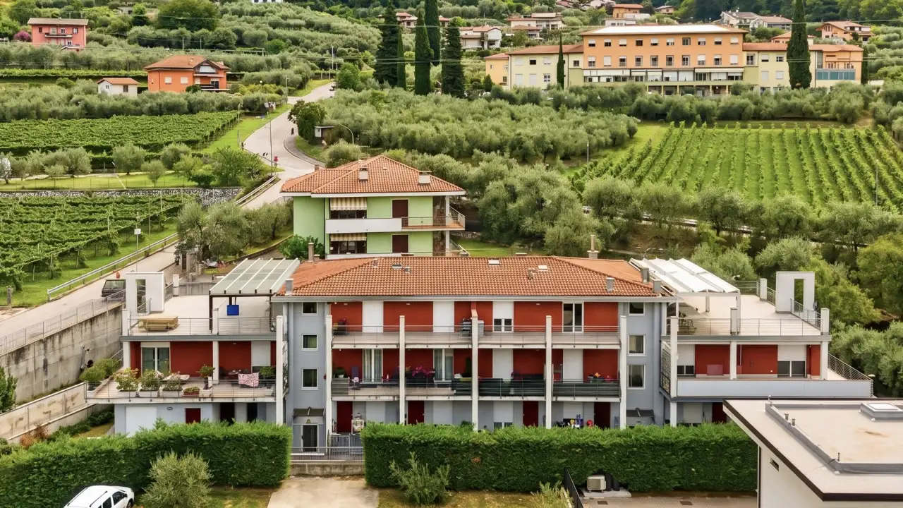 Residential building with gardens and vineyards around