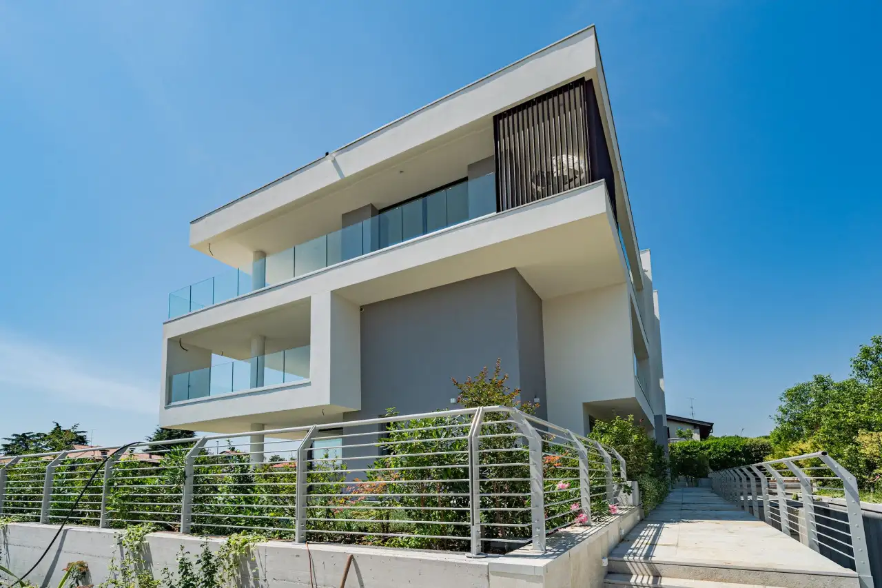 Exterior of modern residence with balconies and glass railings