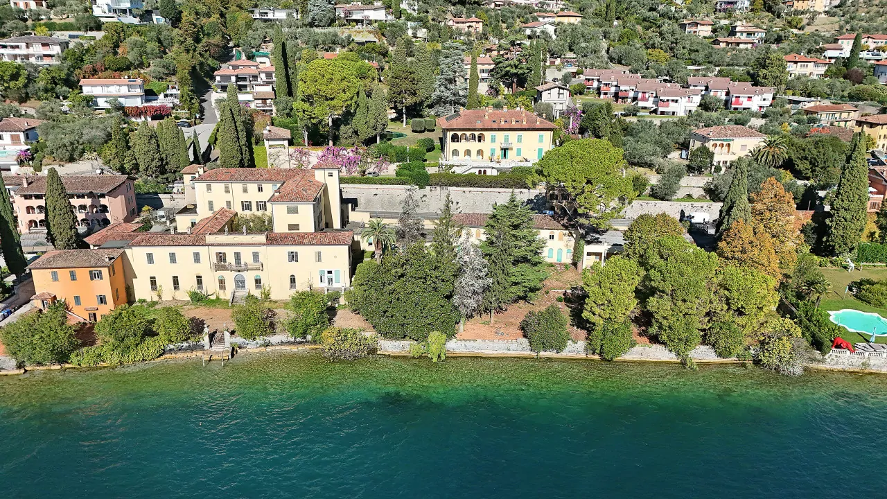 Aerial view of the Liberty villa with garden and pool in Gardone Riviera
