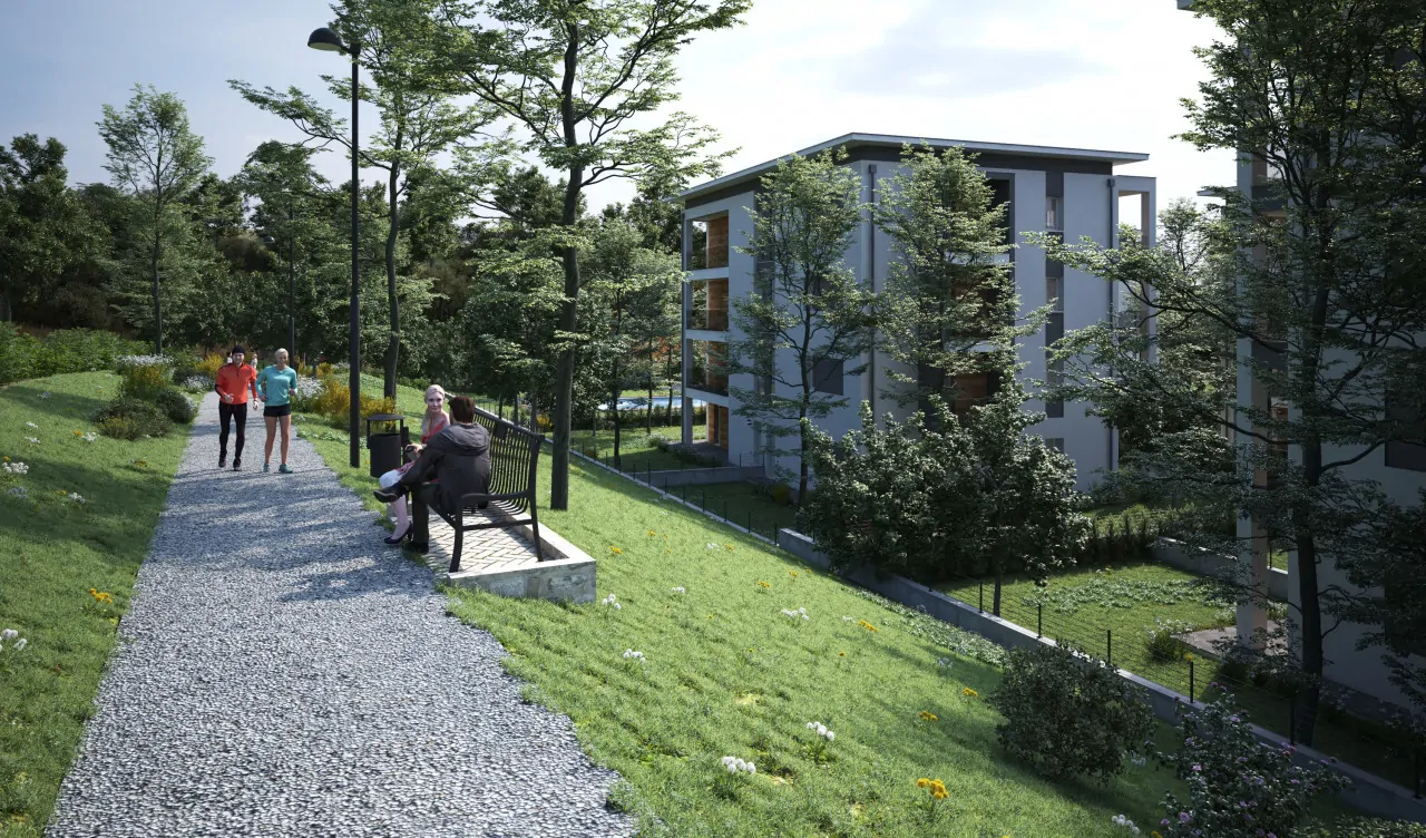 Pedestrian path with benches and trees near modern apartment buildings